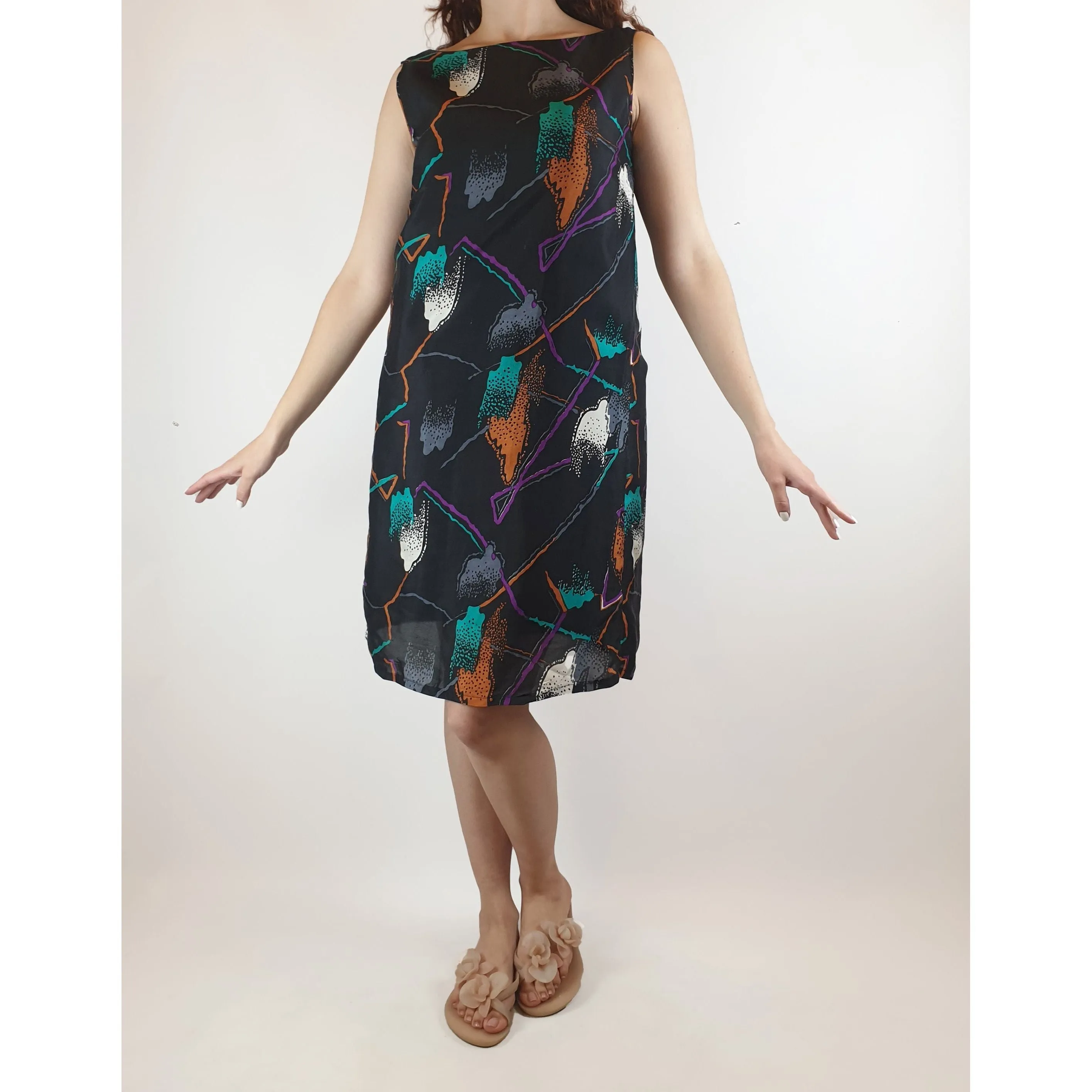 Vintage black silky feel sleeveless dress with lovely and unique print best fits size 10
